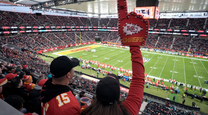 Chiefs fans cheer as they watch their team play the Dolphins during the first half of an NFL game in Frankfurt, Germany.